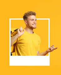 Handsome male student looking out of frame on yellow background