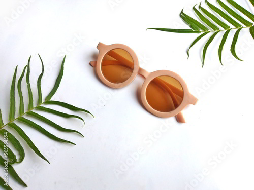 Retro style of sunglasses isolated on white background, top view. Summer Concept.