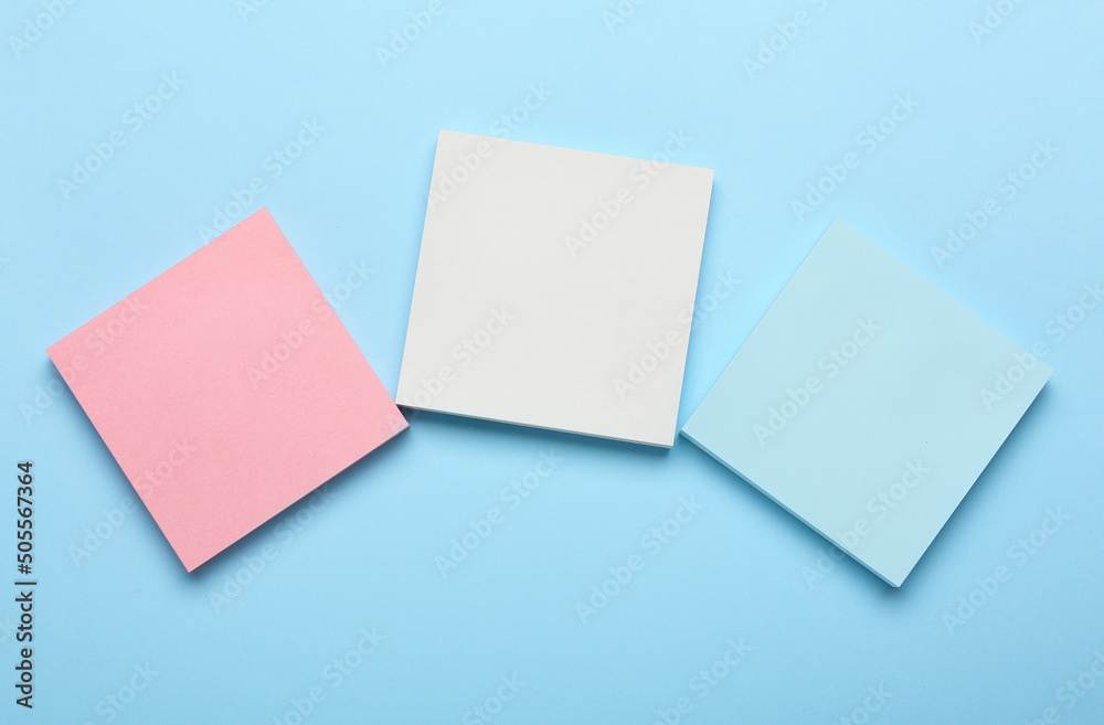 Different blank sticky notes on color background