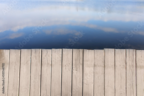 Wooden pier on lake background