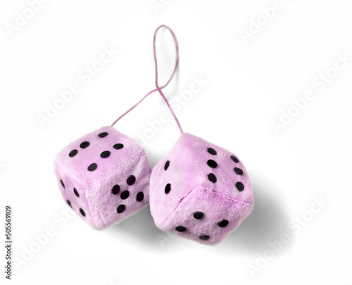 Фотография Pink fuzzy dice isolated on a white background