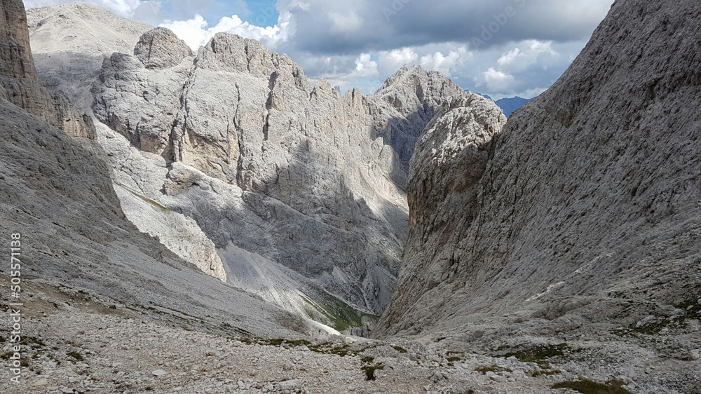 Mountain landscape with rocky passage through mountain massif, Dolomites, Trentino-Alto Adige, Italy.
