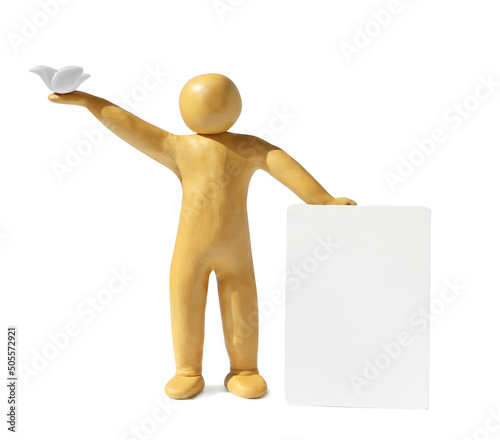 Yellow plasticine human figure with dove and blank card isolated on white, space for text