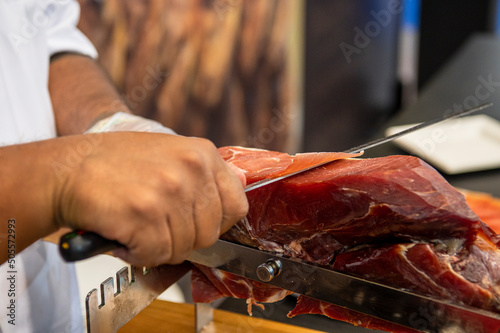 Prosciutto (Jamon serrano) Traditional spanish ham slicing cut by hand with a knife.