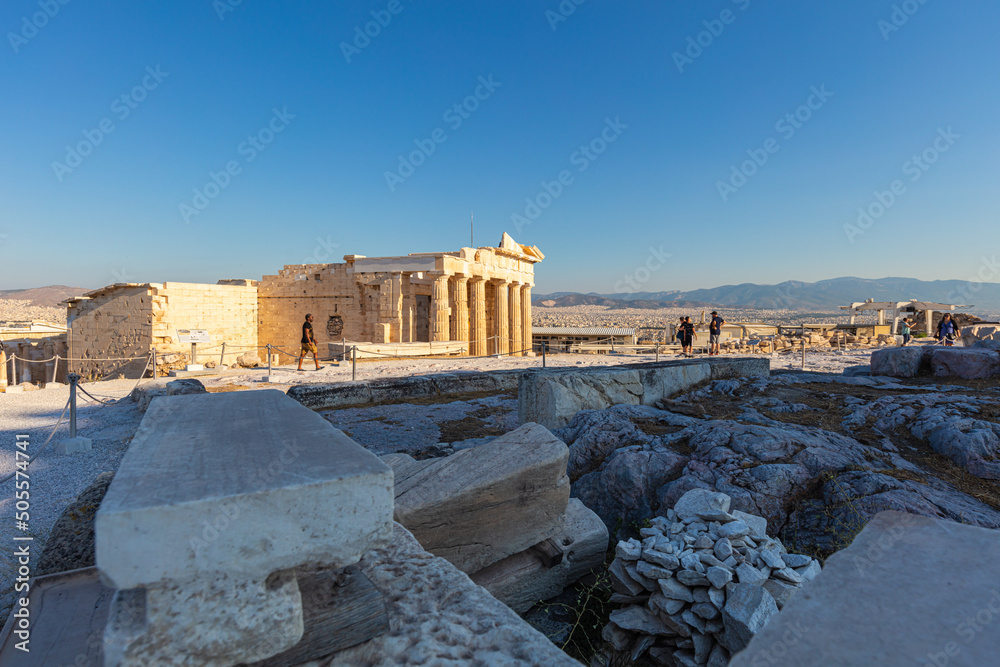 Obraz premium Athens, Greece - July 26, 2021: The acropolis, most famous citadel the Parthenon on the hills of Athens. One of the most visited travel destinations. Tourists from all over the world come to visit