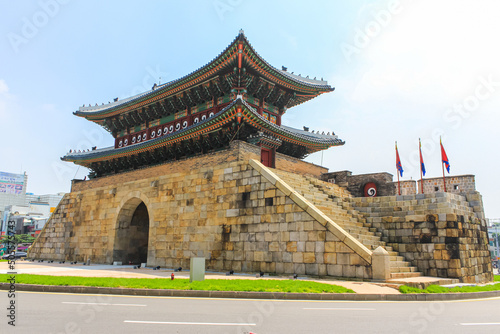 Seoul, South Korea - July 26, 2020 - Paldalmun Gate is the southern gate of Hwaseong Fortress. The gate has an entrance wide enough to let the king's palanquin pass through. Roundabout runs around photo