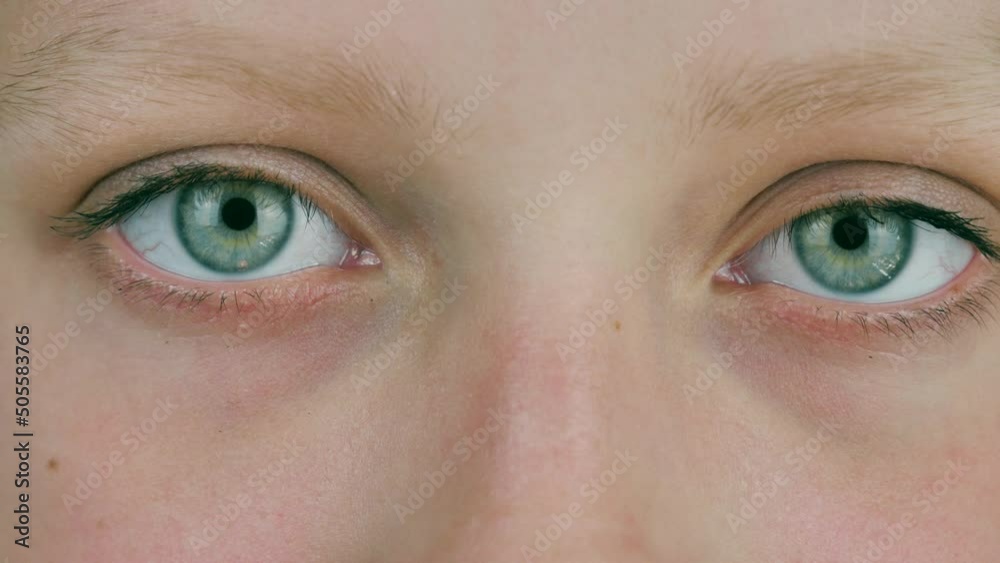 close-up of the eyes of a beautiful caucasian girl.positive girl looks at the camera close-up of the eyes of a beautiful caucasian girl.positive girl looks at the camera