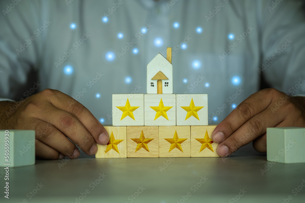 Εκτύπωση καμβά Broker with miniature home and icons with gold seven star rating, level excellen