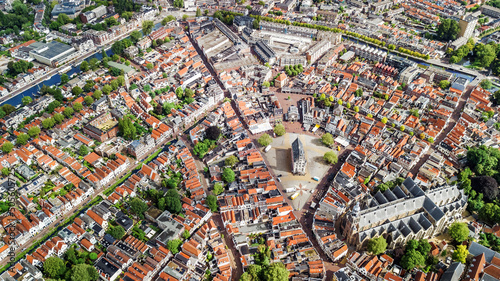 Aerial drone view of Gauda town cityscape from above, typical Dutch city skyline with canals and houses, Holland, Netherlands