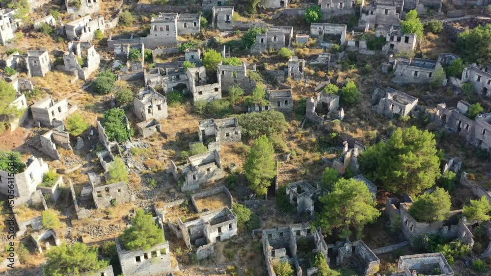 aerial top down view of Kayakoy's broken and ruined buildings that have been abandoned for hundreds of years located in the mountains of Fethiye Turkey aerial top down view of Kayakoy's broken and ruined buildings that have been abandoned for hundreds of years located in the mountains of Fethiye Turkey