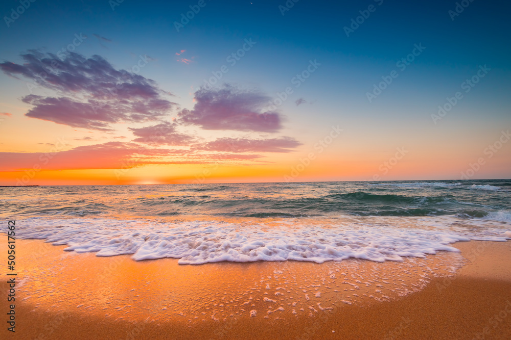 Beautiful sunrise over the sea sand and beach. Ocean beach.