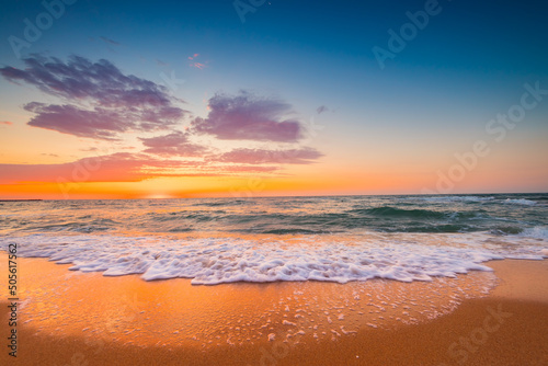 Beautiful sunrise over the sea sand and beach. Ocean beach.