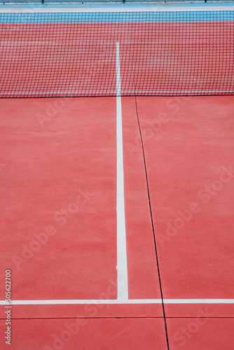 View of a red hard-surface tennis court