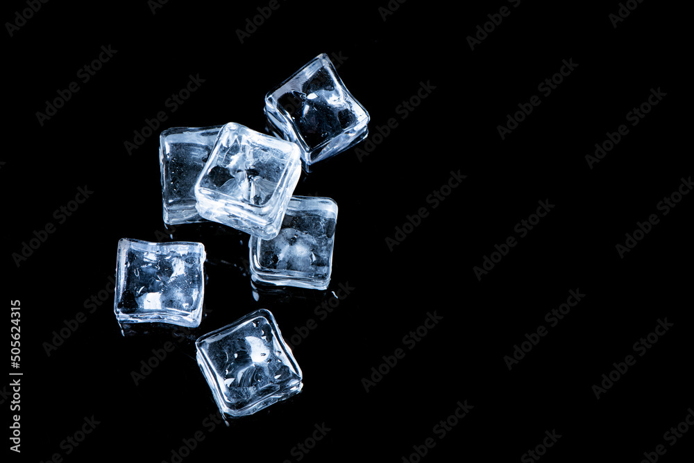Natural crystal ice cubes isolated on black background.