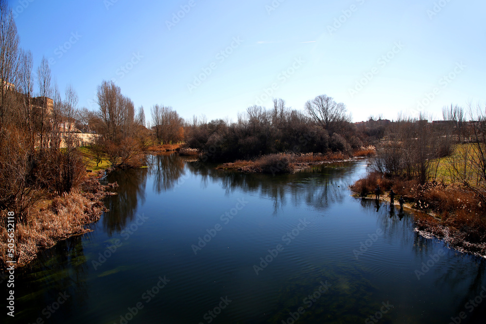 Scenic view of the Tormes River with reflection of plants and trees