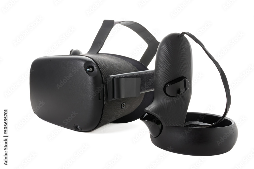 Close-up of the joystick and VR helmet isolated on a white background. Virtual reality kit. Controller and VR glasses. Side view. Close-up of the joystick and VR helmet isolated on a white background. Virtual reality kit. Controller and VR glasses. Side view.