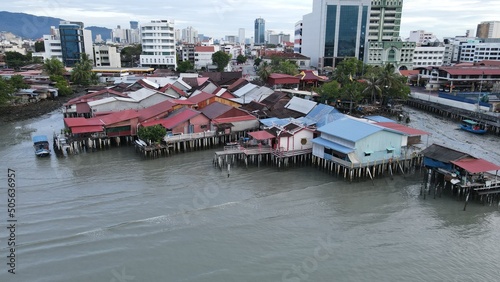 Georgetown, Penang Malaysia - May 13, 2022: The Clan Jetties of Georgetown Penang, Malaysia. Wooden villages built on stilts at the sea coast by the different clans of the Penang Chinese community. photo