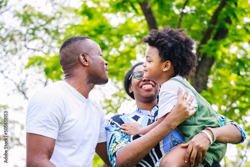 Love moment of Happy African American family in the park in springtime © chayantorn