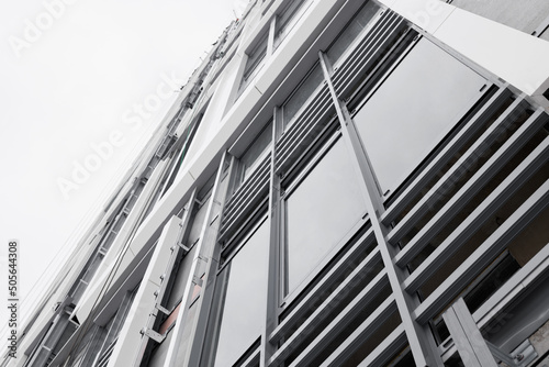 The system of fixing the facade on the building. Aluminum decorative profiles on the building. Modern architectural solutions. Ventilated facade with stone wool insulation and ceramic tiles