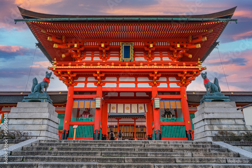 Fushimi Inari Shrine at sunrise, Kyoto, Japan. The japanese on the building means Fushimi Inari Shrine.