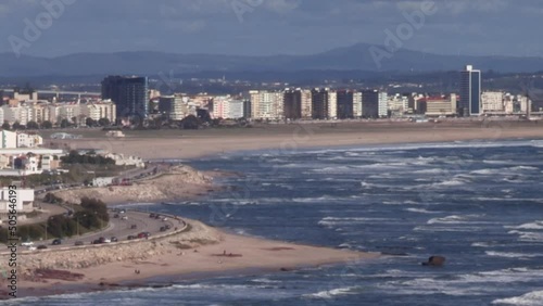 Praia da Claridade, one of the largest beaches in Europe, its extensive golden arial is in the city of Figueira da Foz. View of the Boa Viagem mountain range. photo