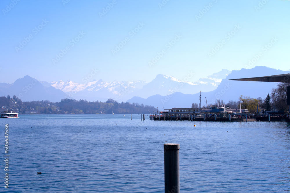 Lake Luzern seen from the old town of City of Luzern with Swiss Alps in the background on a sunny spring day. Photo taken March 23rd, 2022, Lucerne, Switzerland.