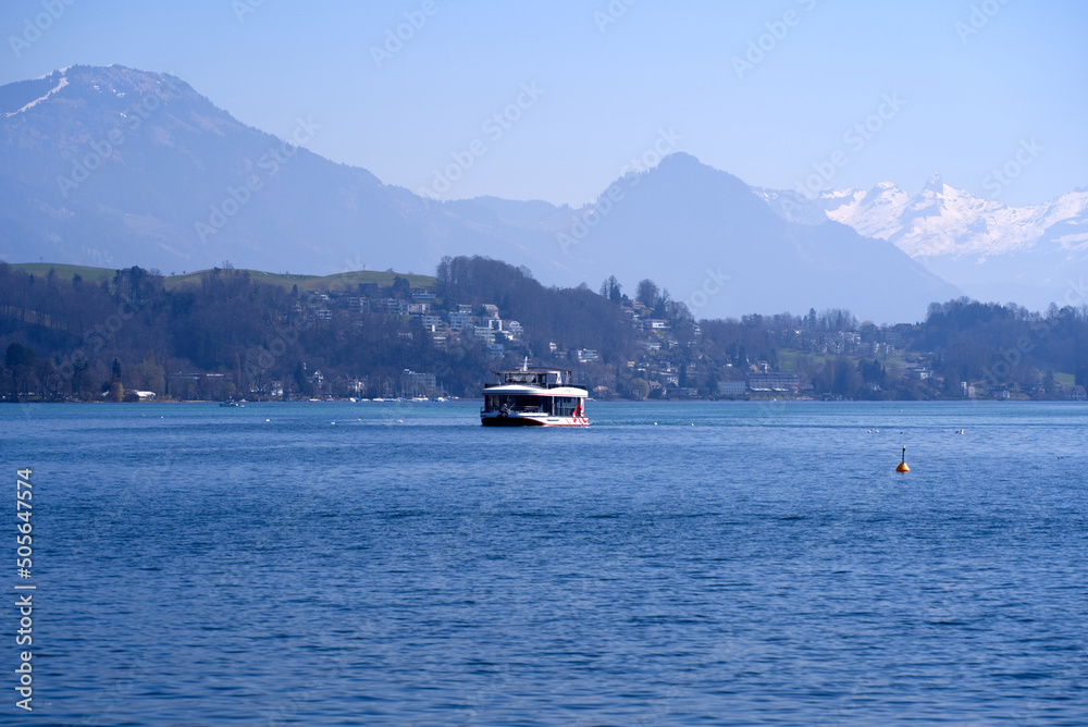 Lake Luzern seen from the old town of City of Luzern with Swiss Alps in the background on a sunny spring day. Photo taken March 23rd, 2022, Lucerne, Switzerland.