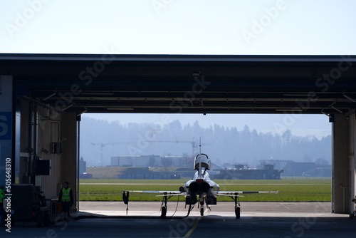 Fighter plane Northrop F-5E Tiger II at Swiss Air Force Airbase on a sunny spring noon. Photo taken March 23rd, 2022, Emmen, Switzerland.