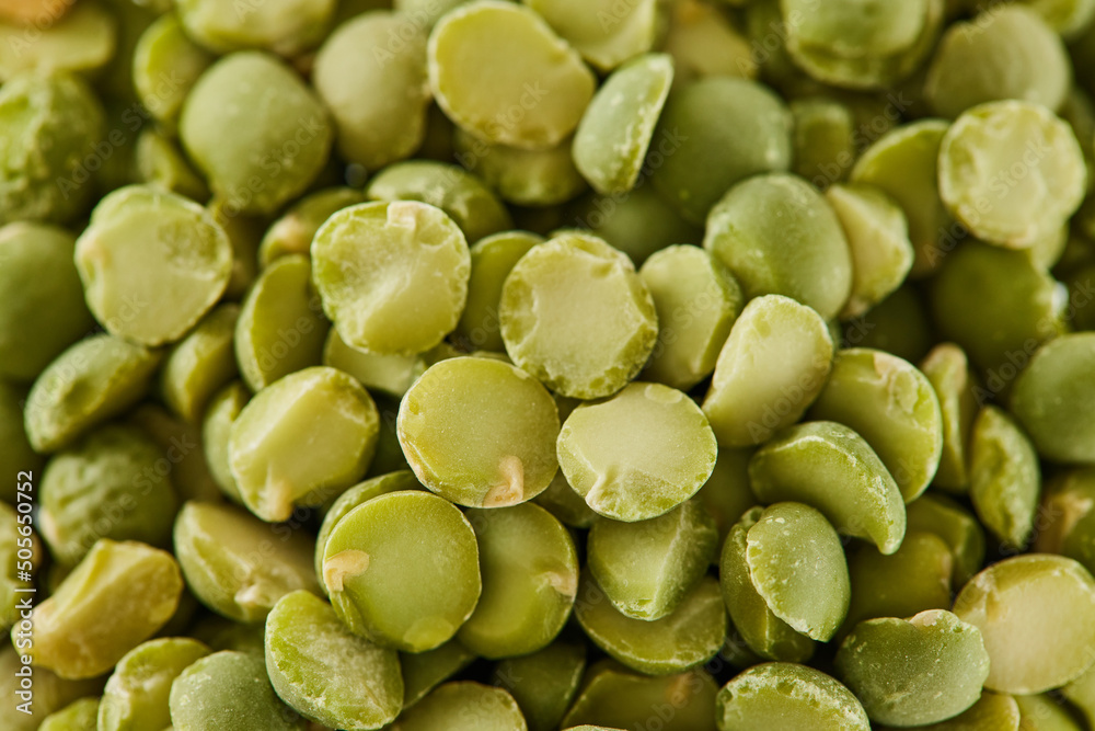 Macro grinding green peas pile. Natural food background. Top view backdrop. Macro grinding green peas pile. Natural food background. Top view backdrop.