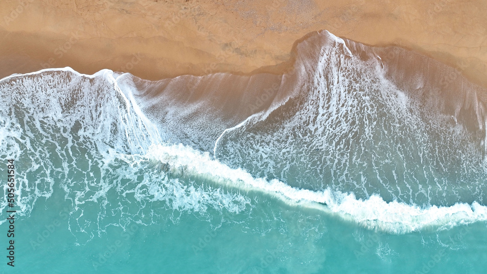 The tropical in Summer seascape with beach waves from aerial  Top view from drone. Travel concept and idea