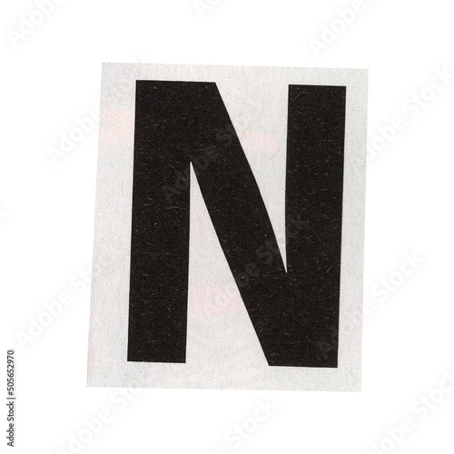 letter n magazine cut out font, ransom letter, isolated collage elements for text alphabet. hand made and cut, high quality scan. halftone pattern and texture detail. newspaper and scraps