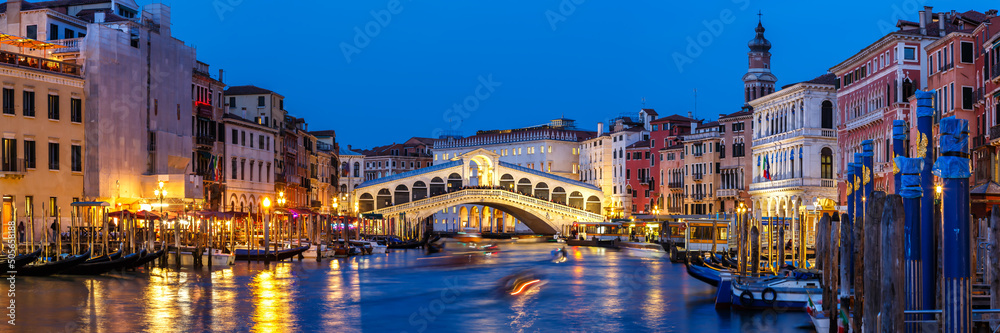 Venice Rialto bridge over Canal Grande with gondola travel traveling holidays vacation town panorama at night in Italy - obrazy, fototapety, plakaty 