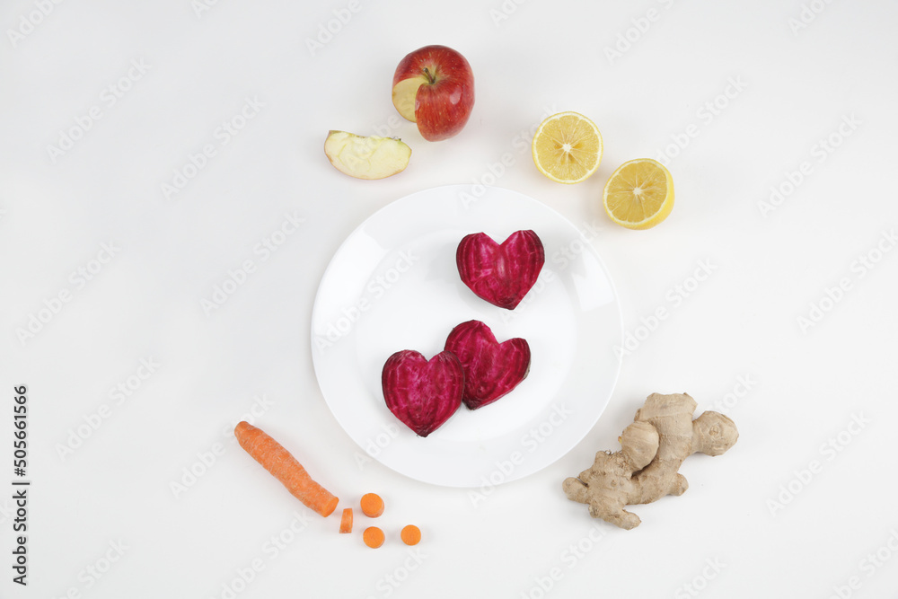 beetroot carrot lemon ginger on a white background beetroot carrot lemon ginger on a white background