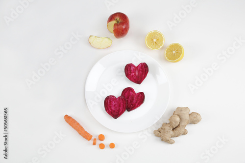 beetroot carrot lemon ginger on a white background