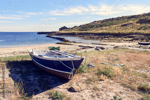 Traditional fishing rowboat in the Galician coast, Northern Spain. photo