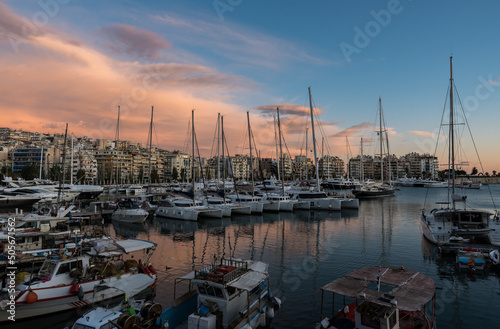 Freattyda, Athens - Greece - Golden hour landscape view over the marina of Piraeus with boats and pink clouds © Werner