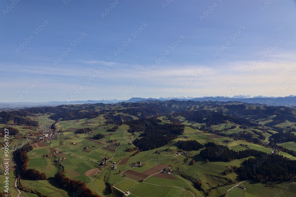 hot air balloon switzerland summer landscape with blue sky and green landscape