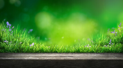 A wooden table product display with lush green  garden background of grass and blurred foliage.