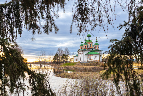 OLONETS, RUSSIA: View of the Smolensk Cathedral of the icon of the mother of God from the side of the river Megrega in twilight photo