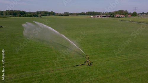 Watering an agricultural field with water sprinkler in area the Achterhoek in the Netherlands, Aerial