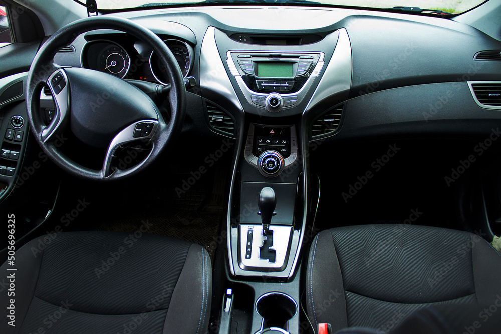 Vehicle interior. Torpedo and steering wheel. Automatic transmission.