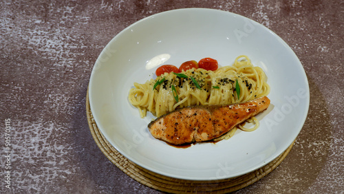 A salmon stack with spagehetti background photo