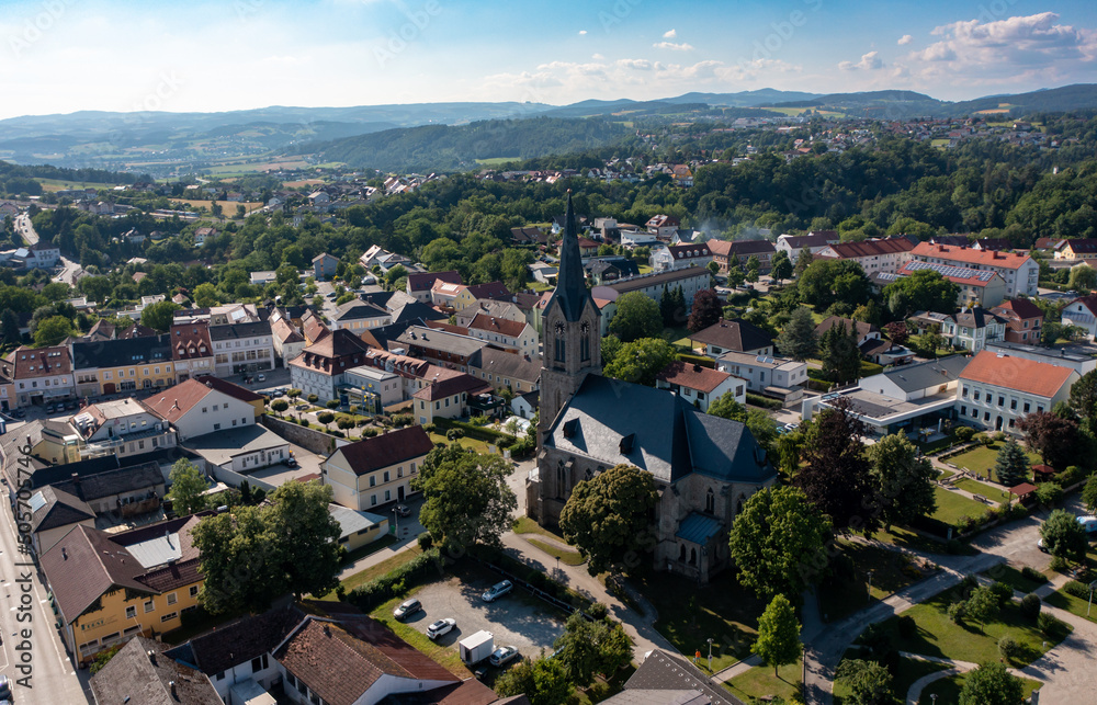 Drone view of the city of Pregarten. Bird's eye view of the old church, the clock tower on the square in Austria, Tyrol