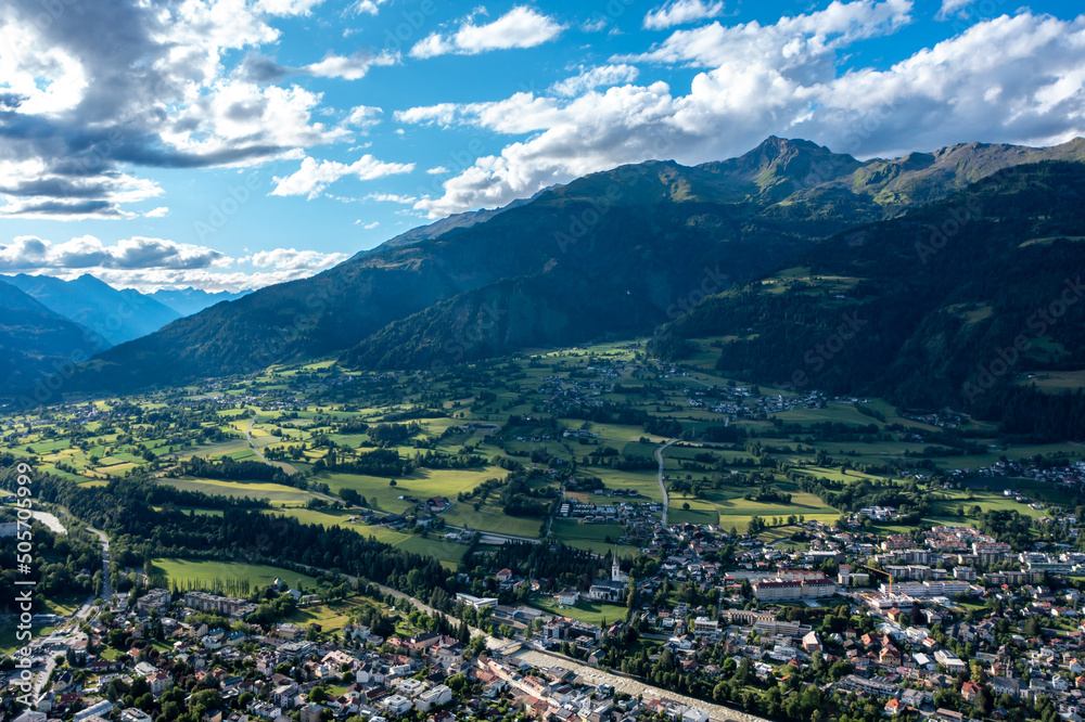 Beautiful mountain view in the city of Lienz, Austria. Alpine mountains, clouds and sunlight over the city. Aerial view over the Austrian city in the mountains Alps