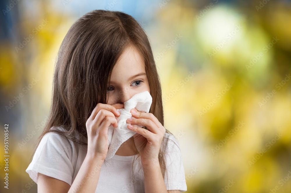 Little girl with allergies wipes her nose with a handkerchief Little girl with allergies wipes her nose with a handkerchief