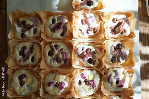 Dough balls, making focaccia bread with onion and olives