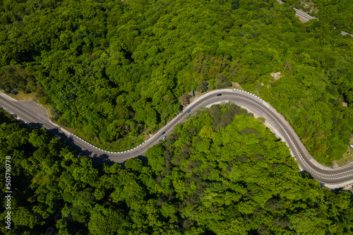 Aerial view of cars on a curvy road in mountain