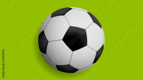 Classic soccer ball isolated on green background
