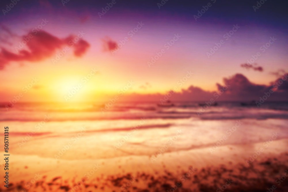 Fantastic view of calm sea water waves with orange sunrise sunset sunlight. Tropical beach landscape.