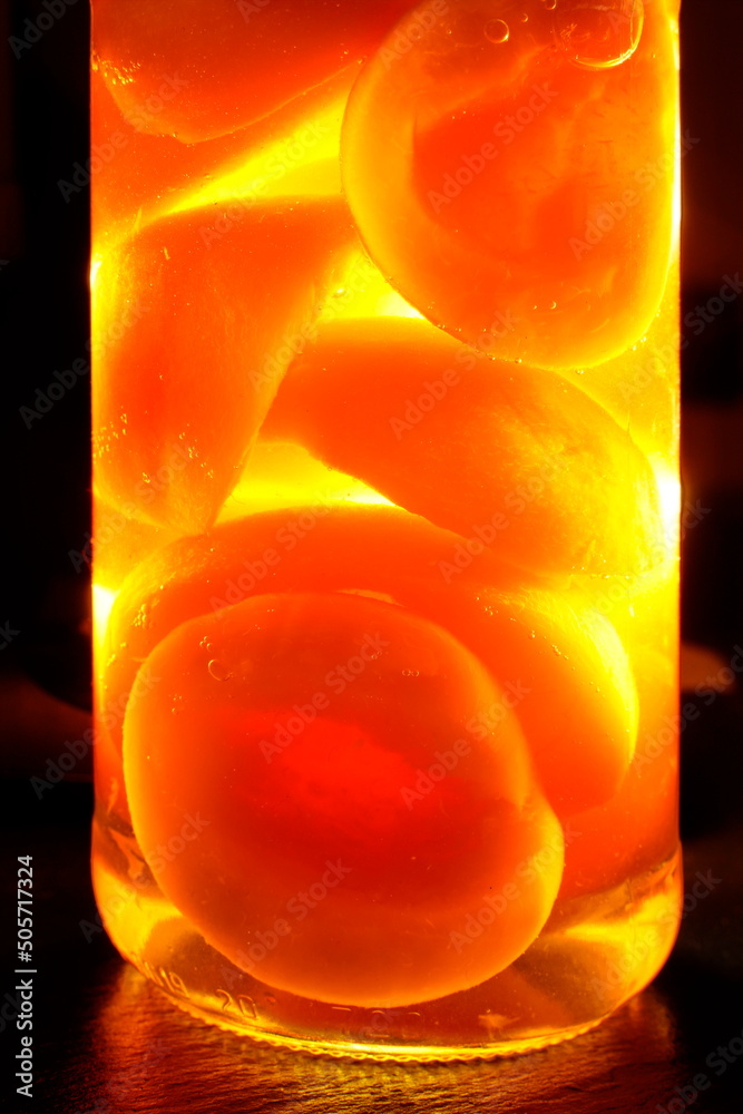 Half Peaches in Syrup in a Jar / Halbe Pfirsiche in Sirup im Glas